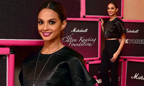 Alesha Dixon flashes her abs in a bikini top and packs on the。